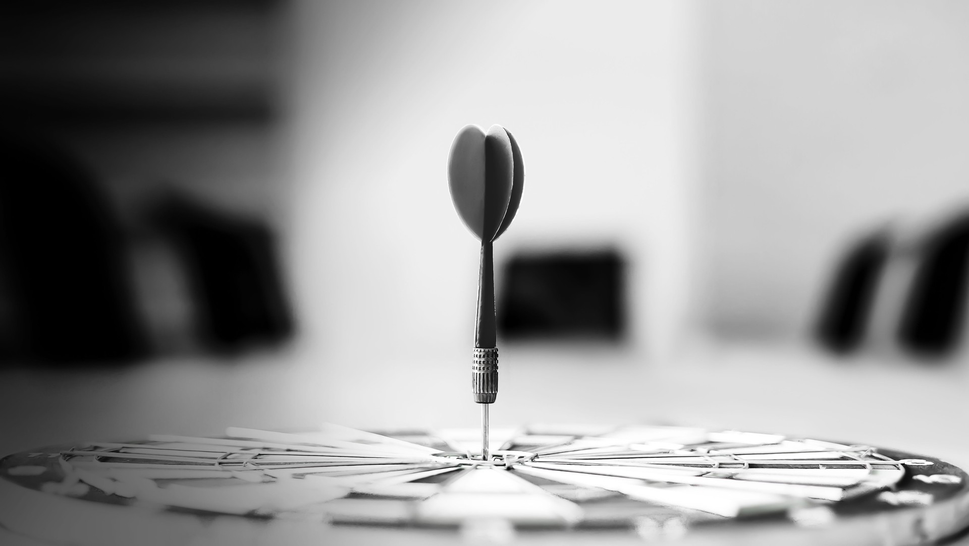 Dart is an opportunity and Dartboard is the target and goal.So both of that represent a challenge in business marketing as concept.